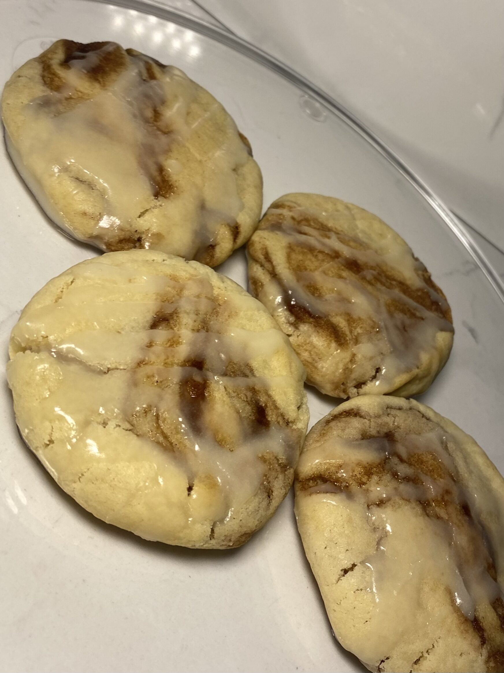 Cinnamon Roll Cookies with icing and brown sugar swirl.